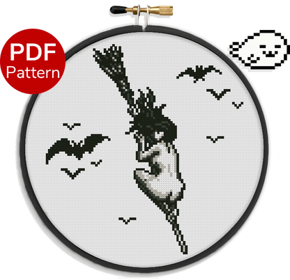 cross stitch pattern of a naked witch flying on a backwards broom