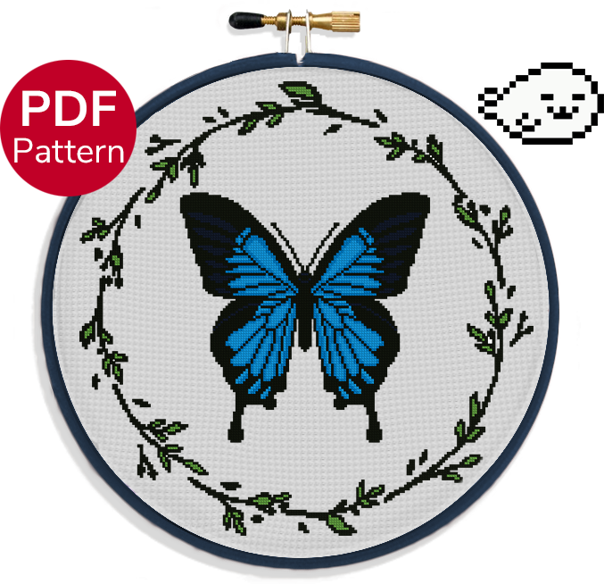 cross stitch pattern of a large ulysses butterfly with blue wings and a leaf wreath around it