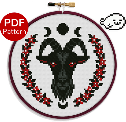 cross stitch pattern of a black goat with red eyes and red and black flowers around it