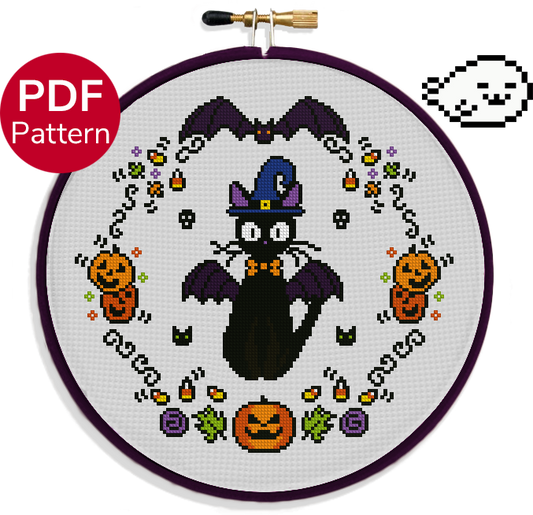 cross stitch pattern of a cat wearing a bat costume with Halloween elements such as pumpkins, bats, and candy corn decorating the background