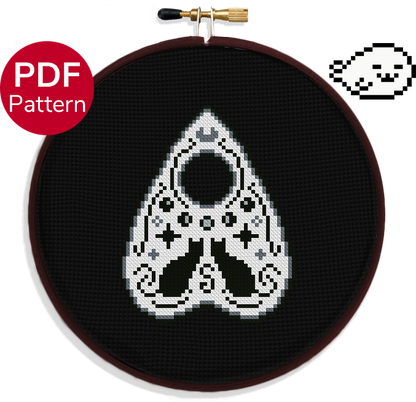 cross stitch pattern of a cat themed planchette