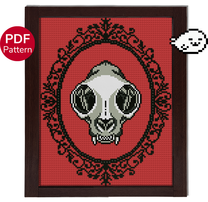 cross stitch pattern of a cat skull with an ornate gothic motif around