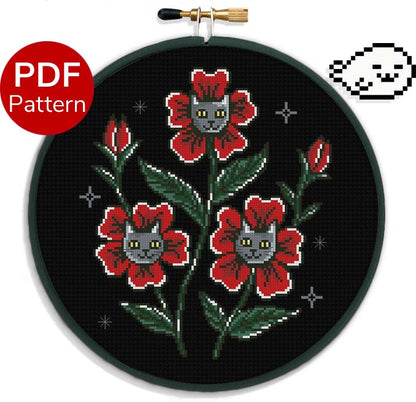 cross stitch pattern of red flowers with grey cat faces in the middle of the petals