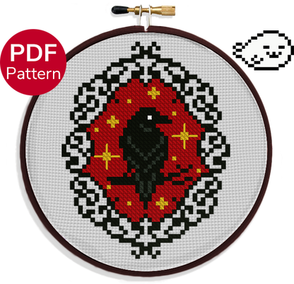 cross stitch pattern of a raven ornament with a gothic frame and red background