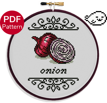 cross stitch pattern of two red onions, one chopped in half, with ornate decoration around it