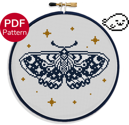 cross stitch pattern of a black and white moth with stars and moon patterns on its wings